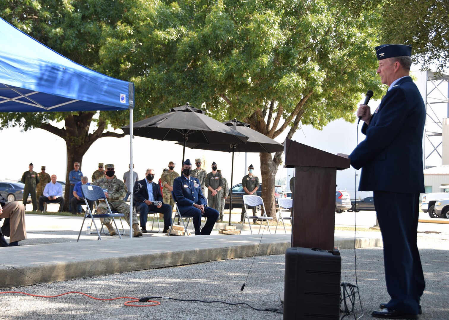Col. Terry W. McClain, 433rd Airlift Wing commander, makes opening remarks during a remembrance and wreath laying ceremony for mission BRAVO-12 Aug. 28, 2020 at Joint Base San Antonio-Lackland, Texas.