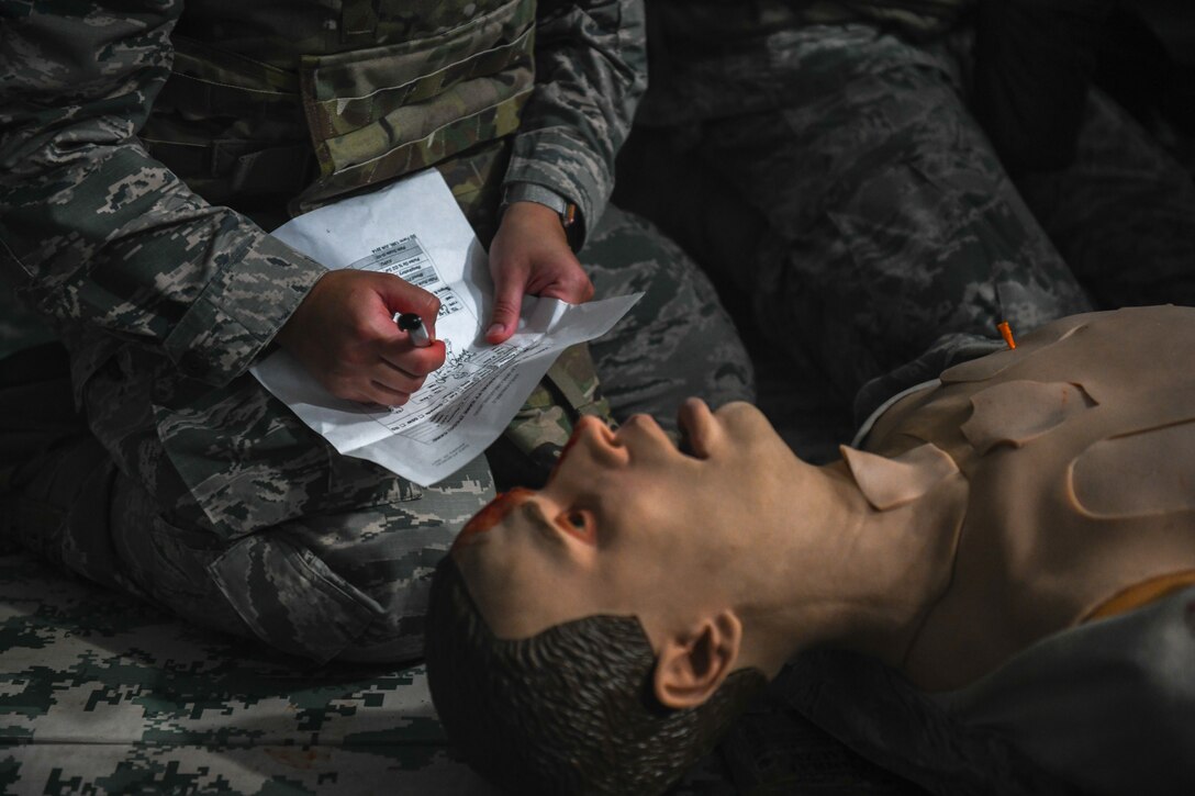 Dermatologist technician records simulated wounds.