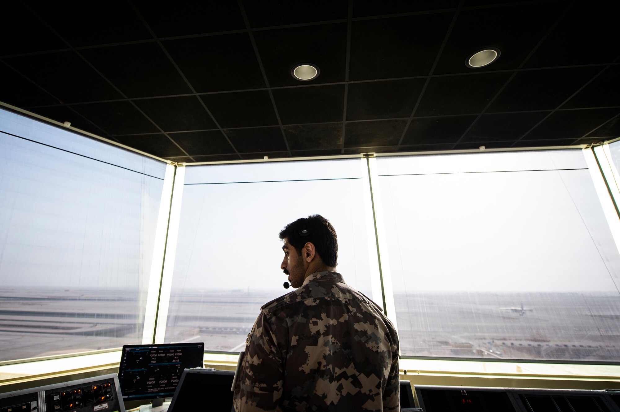 A member of the Qatar Emiri Air Force (QEAF) air traffic control tower directs aircraft at Al Udeid Air Base, Qatar, Aug. 24, 2020. A letter of agreement was recently implemented between the U.S., QEAF and Qatar Civil Aviation Authority to better work together to ensure safe air space operations. (U.S. Air Force photo by Master Sgt. Larry E. Reid Jr.)