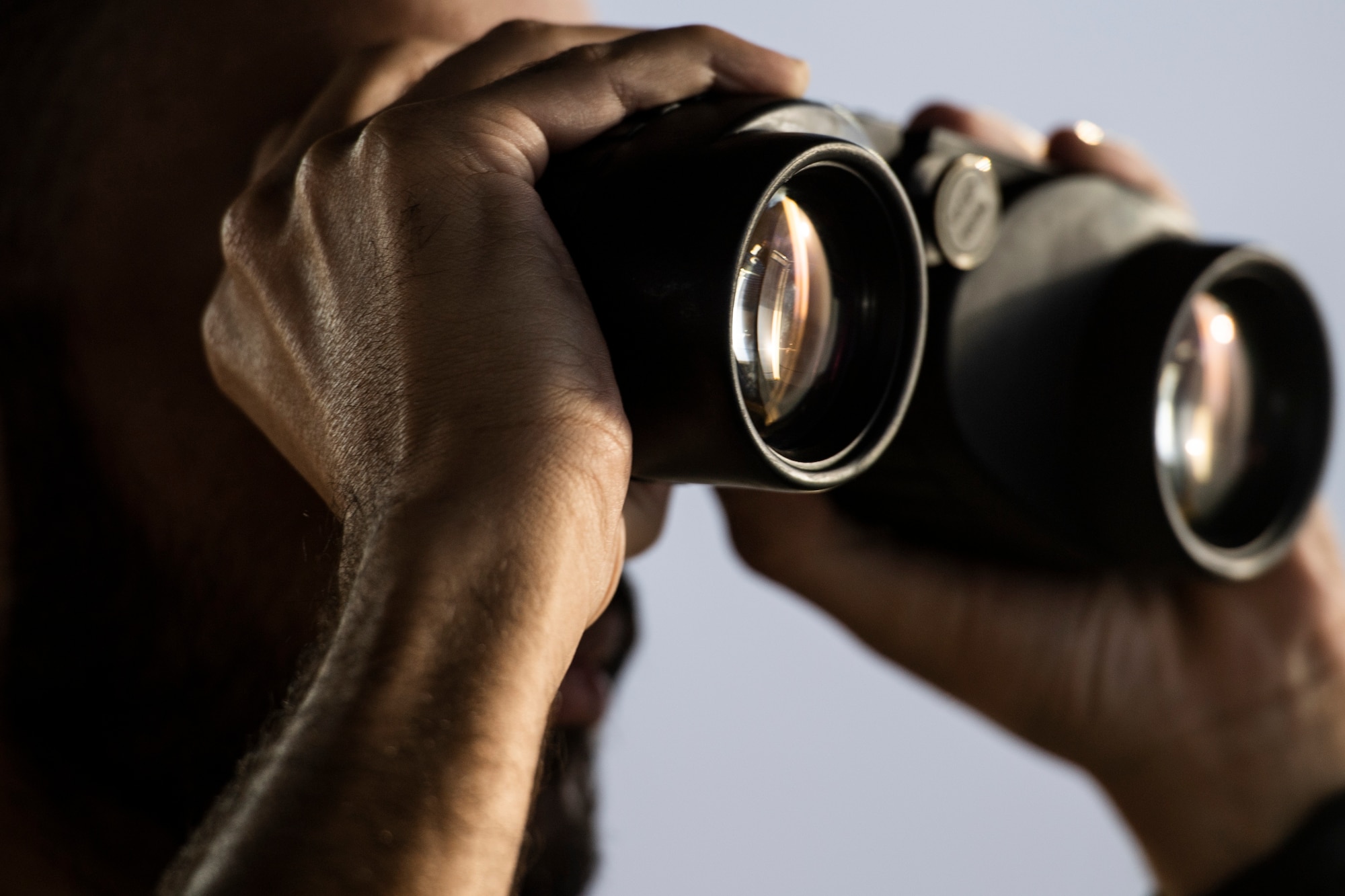 A member of the Qatar Emiri Air Force (QEAF) air traffic control tower looks through binoculars at the flight line at Al Udeid Air Base, Qatar, Aug. 24, 2020. A letter of agreement was recently implemented between the U.S., QEAF and Qatar Civil Aviation Authority to better work together to ensure safe air space operations. (U.S. Air Force photo by Master Sgt. Larry E. Reid Jr.)