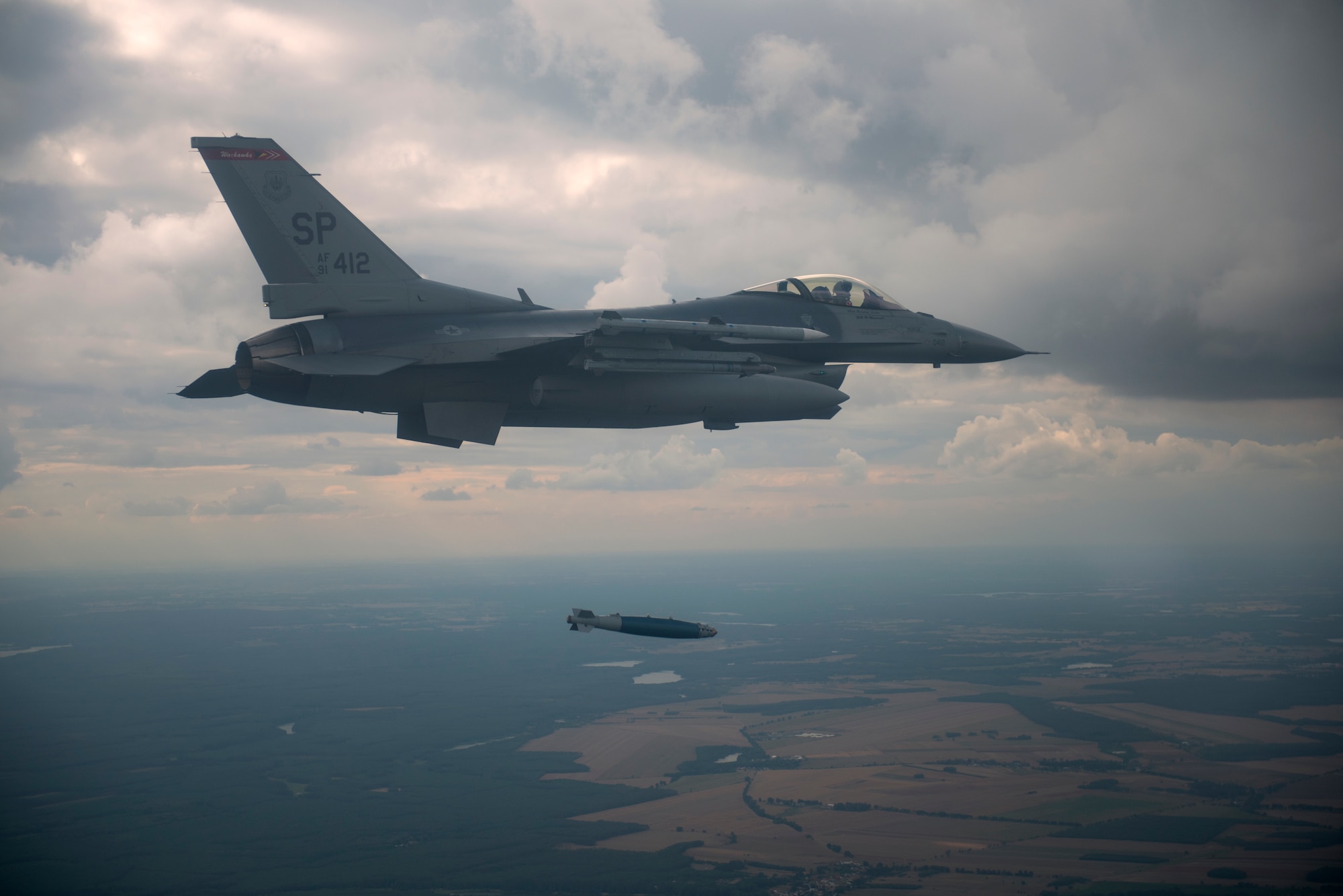 A U.S. F-16 Fighting Falcon assigned to the 480th Expeditionary Fighter Squadron drops an inert guided bombing unit, variation 38, (GBU-38) over the D-37 Range in Nadarzyce, Poland, 24 August 2020. During Aviation Detachment Rotation 20-4 pilots have been able to increase their war-fighting capabilities as well as train alongside their Polish partners and strengthen joint readiness. (U.S. Air Force photo by Senior Airman Chanceler Nardone)