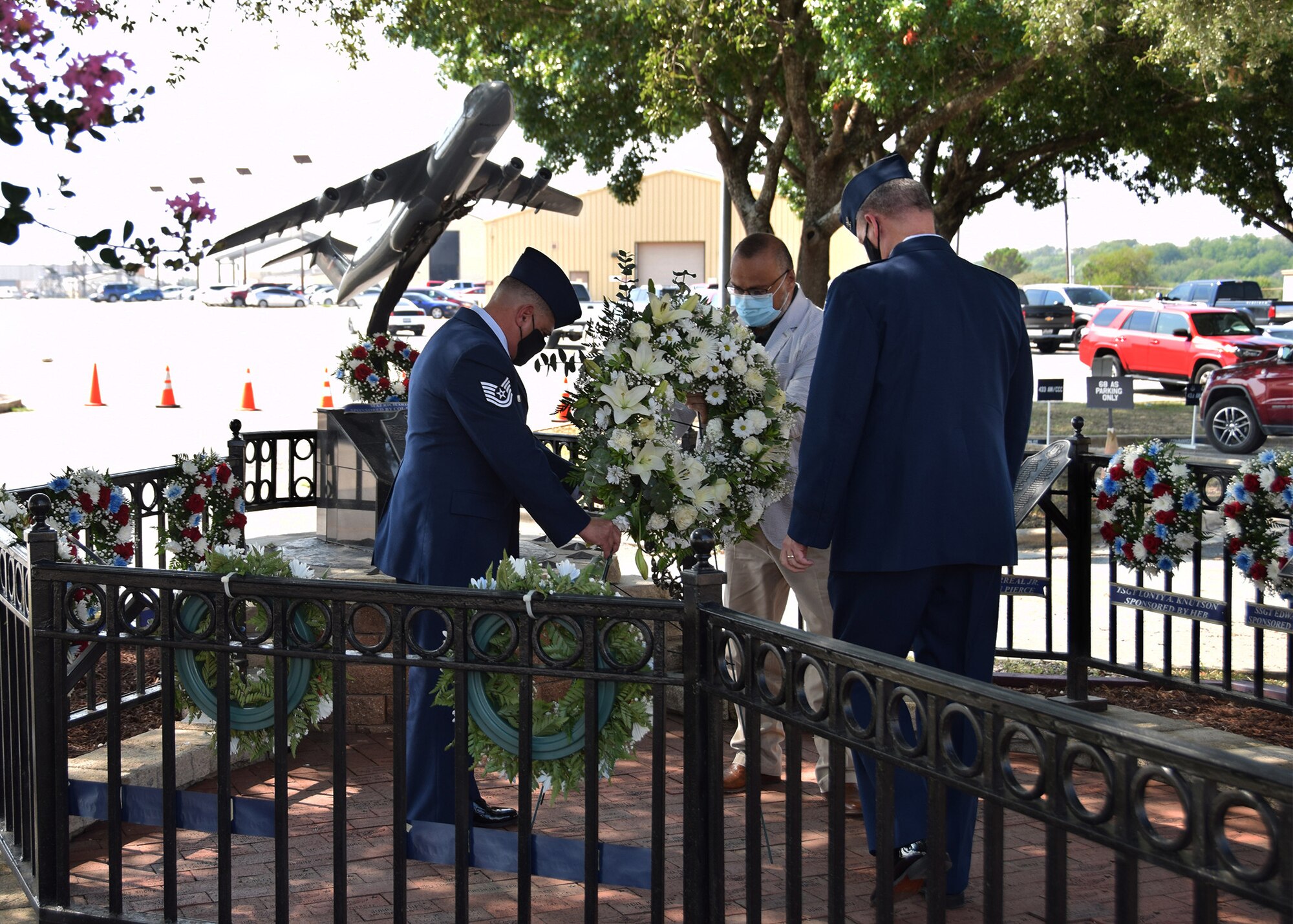 Tech. Sgt. Joe Perez, 26th Aerial Port Squadron ramp service supervisor, John P. Perez, and Col. Terry W. McClain, 433rd Airlift Wing commander, lay a wreath at the BRAVO-12 memorial Aug. 28, 2020 at Joint Base San Antonio-Lackland, Texas.