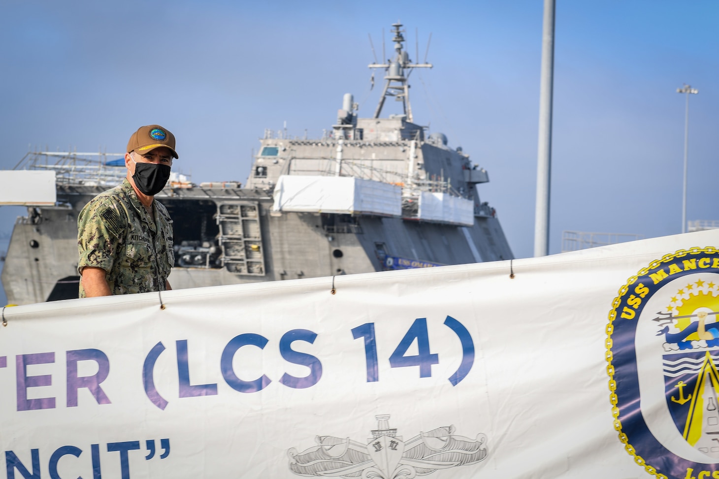 ) Vice Adm. Roy Kitchener, commander of Naval Surface Force U.S. Pacific Fleet, walks aboard the littoral combat ship USS Manchester (LCS 14) for a tour of the ship.