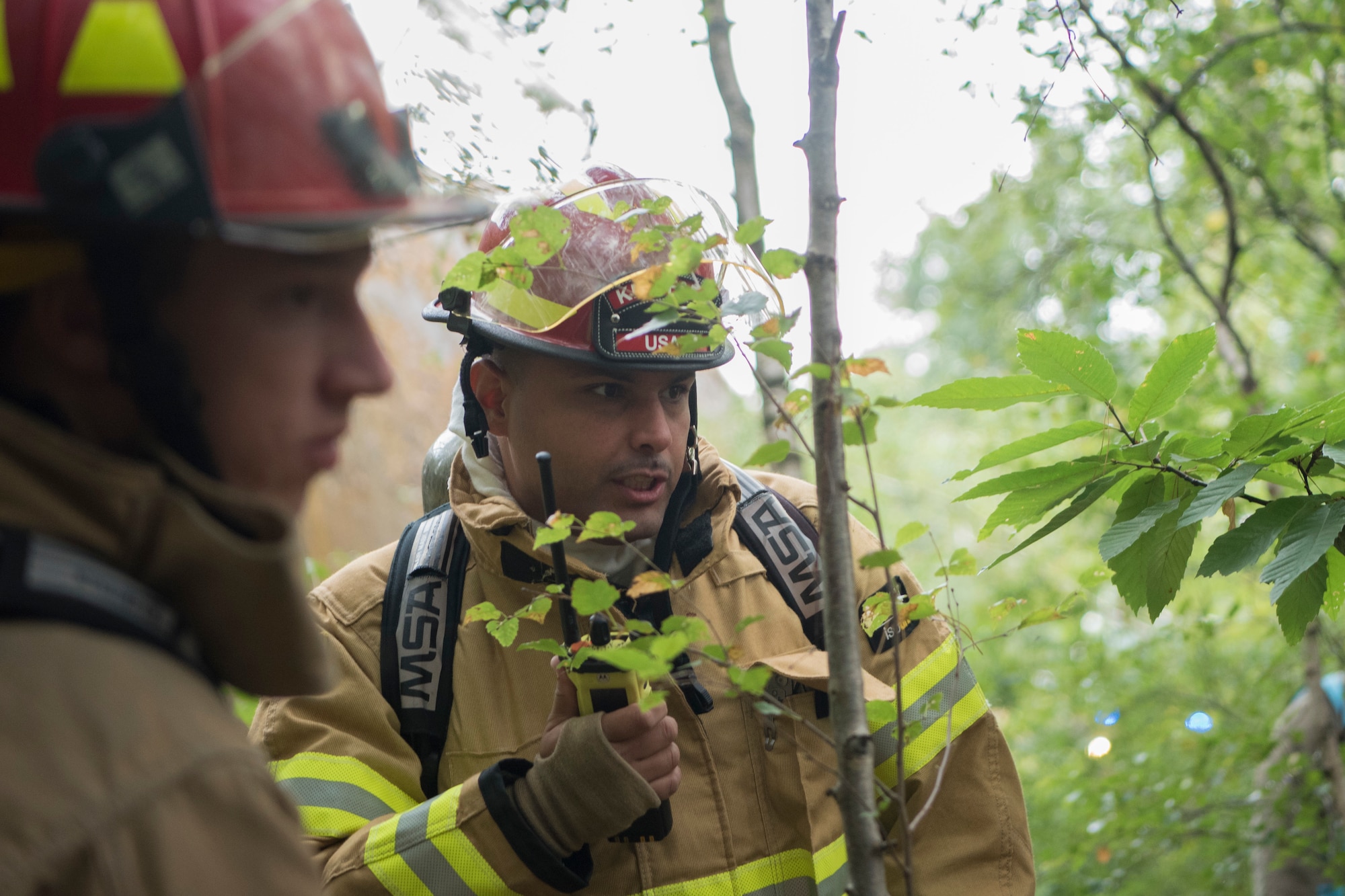 Firefighters talk to each other.