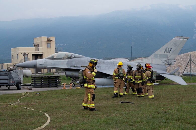 Airmen from the 31st Civil Engineer Squadron secure the scene during a training event at Aviano Air Base, Italy, Aug. 28, 2020. The 31st CES responded to a no-notice inject during a Crashed Damaged Disabled Aircraft Recovering training event. (U.S. Air Force photo by Senior Airman Caleb House)