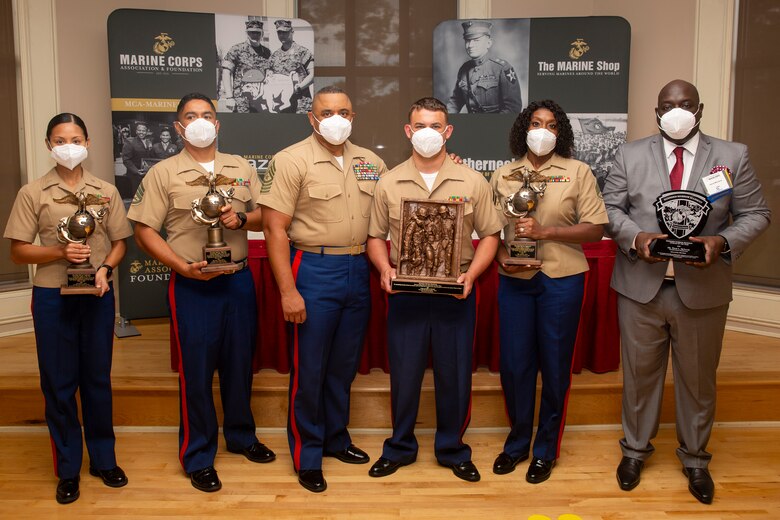 U.S. Marine Corps Sgt. Maj. Edward Parsons, center, sergeant major, Wounded Warrior Regiment, poses with awardees following the 10th annual Wounded Warrior Leadership Awards ceremony hosted by the Marine Corps Association and Foundation (MCA&F), at the Marston Pavilion on Marine Corps Base Camp Lejeune, North Carolina, Aug. 20, 2020. Six Marines and civilians with the Wounded Warrior Regiment were recognized by MCA&F for their professionalism, exceptional leadership and achievements. (U.S. Marine Corps photo by Lance Cpl. Christian Ayers)