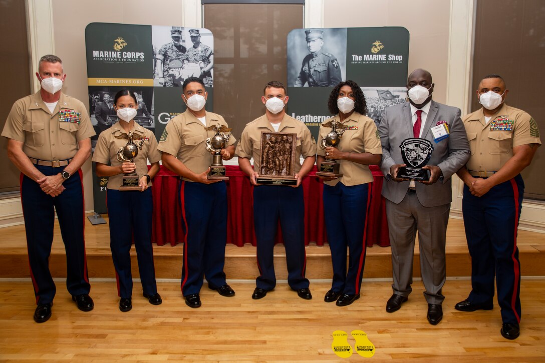 U.S. Marine Corps Sgt. Maj. Edward Parsons, center, sergeant major, Wounded Warrior Regiment, poses with awardees following the 10th annual Wounded Warrior Leadership Awards ceremony hosted by the Marine Corps Association and Foundation (MCA&F), at the Marston Pavilion on Marine Corps Base Camp Lejeune, North Carolina, Aug. 20, 2020 Six Marines and civilians with the Wounded Warrior Regiment were recognized by MCA&F for their professionalism, exceptional leadership and achievements. (U.S. Marine Corps photo by Lance Cpl. Christian Ayers)