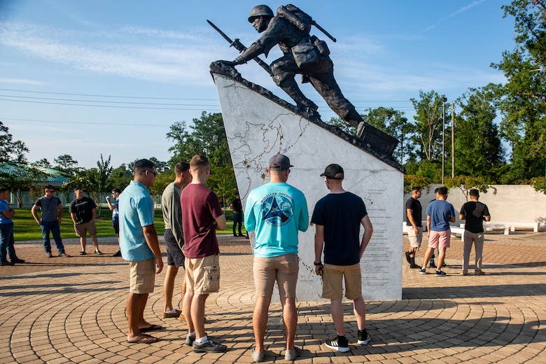 U.S. Marines with 2nd Marine Logistics Group attending the Corporal’s Leadership School on Marine Corps Base Camp Lejeune read the Montford Point Marine Sculpture while visiting the Montford Point Marines Memorial, symbolizing the approximately 20,000 African-Americans that went through Marine Corps boot camp at Montford Point, in Jacksonville, North Carolina, Aug. 26, 2020. This year marks the 78th anniversary of when the first African-American recruits arrived on Montford Point in 1942 for Marine Corps recruit training, paving the way for approximately 20,000 African-Americans over the next 7 years to earn the title of Marine. (U.S. Marine Corps photo by Lance Cpl. Christian Ayers)