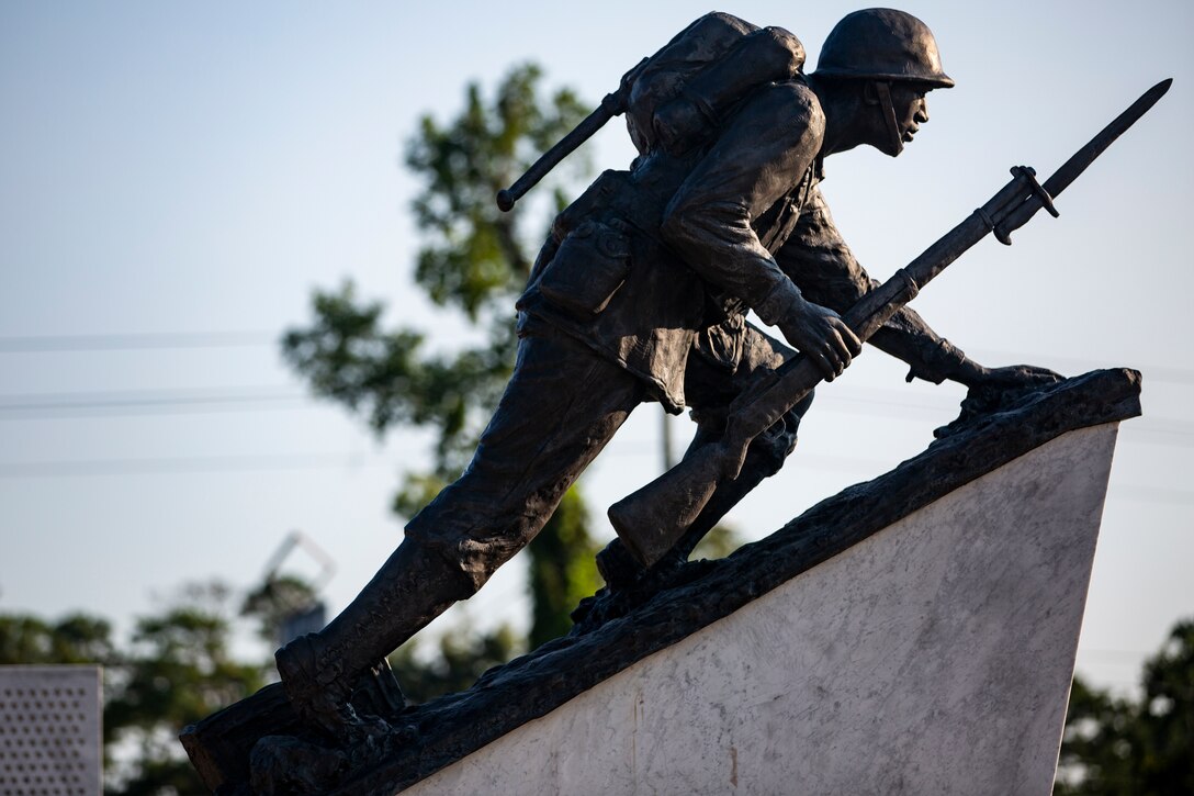 The Montford Point Marine Sculpture that represents the Montford Point Marines; the angle of incline represents the uphill struggle for equality, stands at the Montford Point Marines Memorial in Jacksonville, North Carolina, Aug. 26, 2020. This year marks the 78th anniversary of when the first African-American recruits arrived on Montford Point in 1942 to conduct Marine Corps recruit training, paving the way for approximately 20,000 African-Americans over the next 7 years to earn the title of Marine. (U.S. Marine Corps photo by Lance Cpl. Christian Ayers)