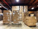 Boxes stacked on pallets in a warehouse.