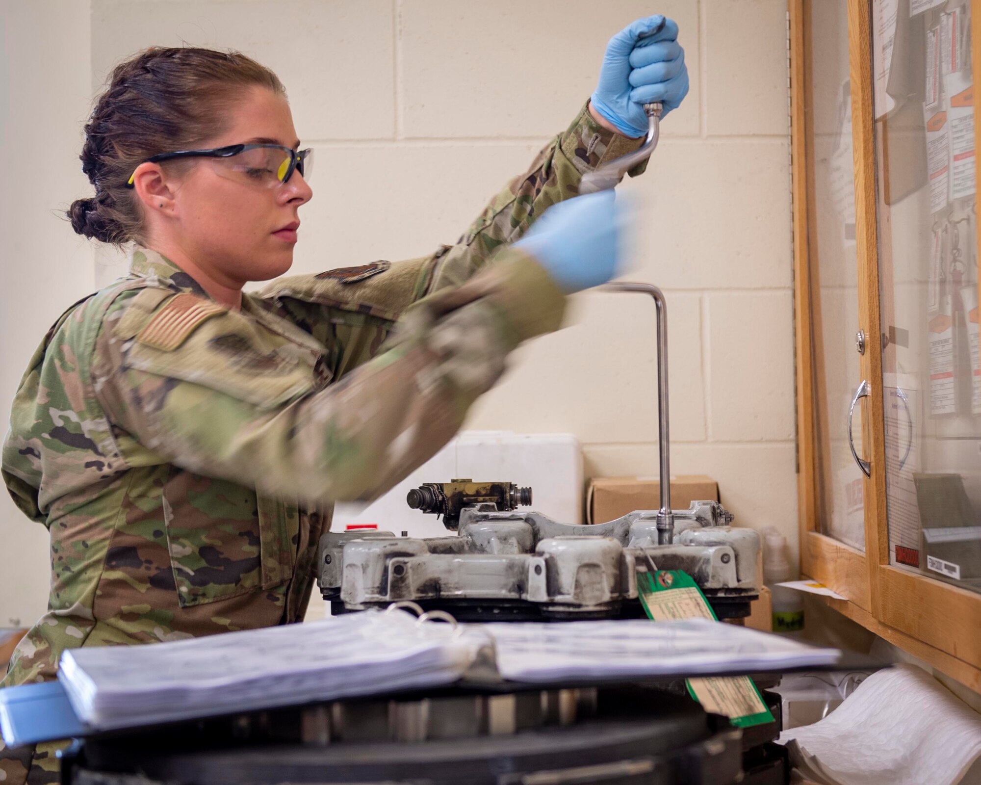 U.S. Air Force Airman 1st Class Maya Kaeding, hydraulic specialist, 133rd Maintenance Squadron, disassembles a brake assembly for refurbishment in St. Paul, Minn., Aug. 21, 2020.