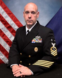 Official portrait of Chief Operations Specialist Brian Adams, the senior enlisted leader of Commander, Carrier Strike Group (CSG) 4.