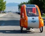 Idaho National Guard Staff Sgt. Daniel Walters, chief dispatcher of ground transportation with the 124th Logistics Readiness Squadron, drives an Elf Solo electric bicycle, Aug. 13, 2020, Gowen Field, Boise, Idaho. The solar-powered bike was purchased to make small deliveries at Gowen Field.