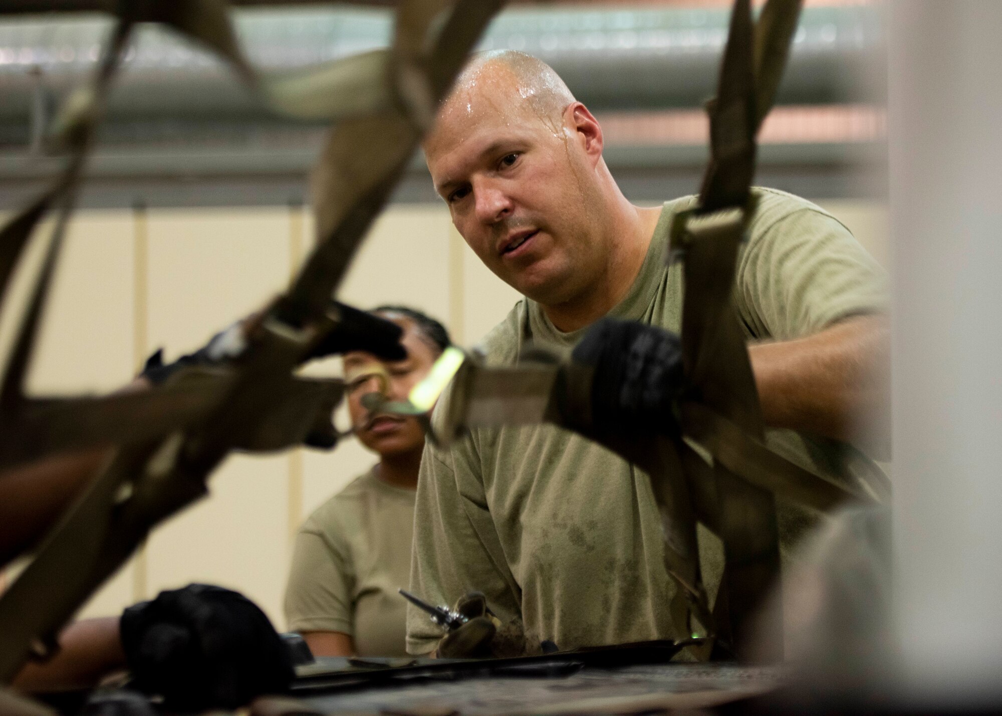 Master Sgt. Michael Shaw from the 39th Logistics Readiness Squadron, checks the quality of a netted down cargo pallet at Incirlik Air Base, Turkey.