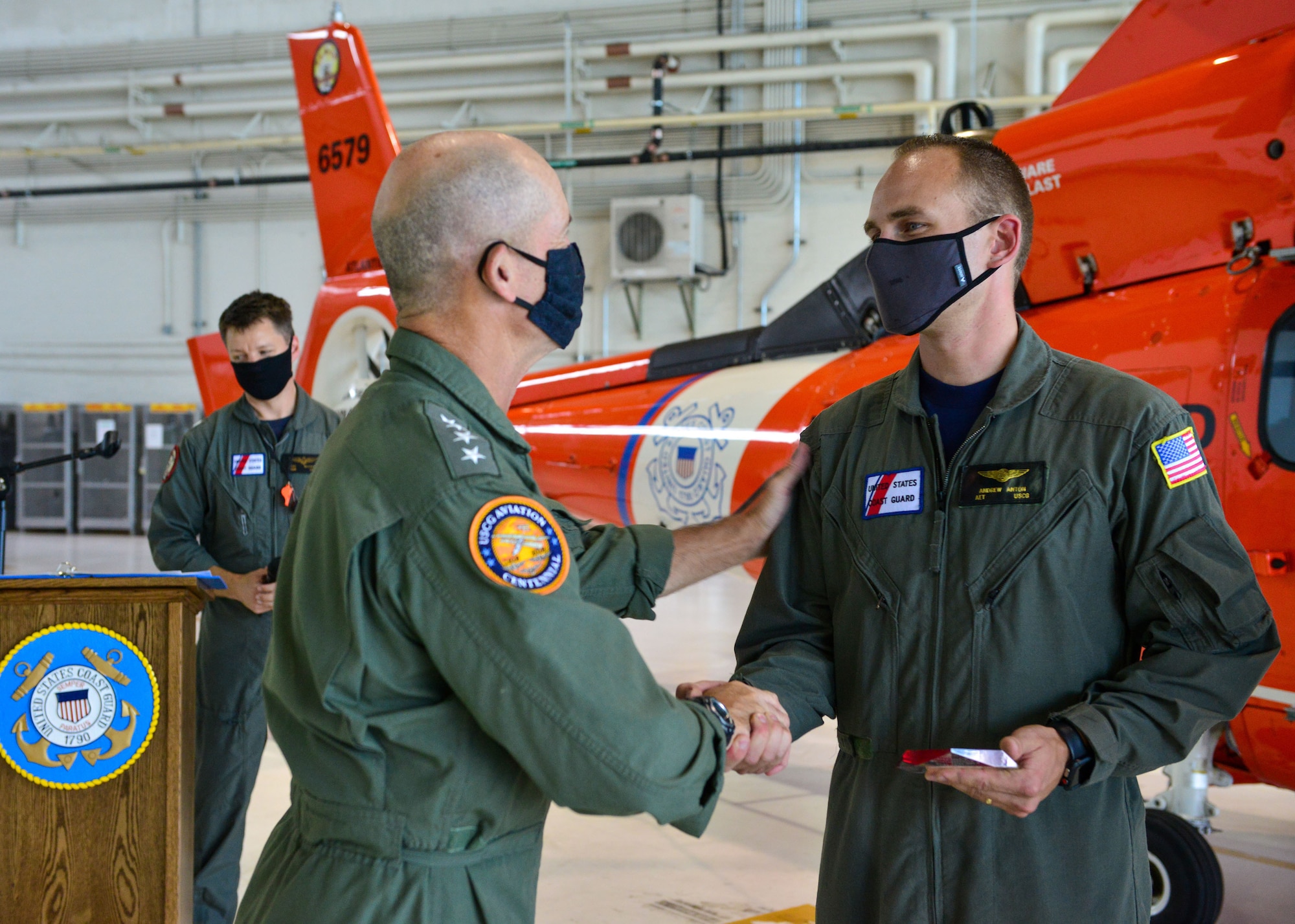 Adm. Charles Ray, the Vice Commandant of the Coast Guard and Deputy Master Chief Petty Officer of the Coast Guard Rob Bushey recognized Petty Officer 1st Class Andrew Anton, an avionics electrical technician as "Maintainer of the Year" for the Continental U.S. NORAD Region Aerospace Control Alert during a ceremony at the National Capital Region Air Defense Facility, Aug. 20, 2020.