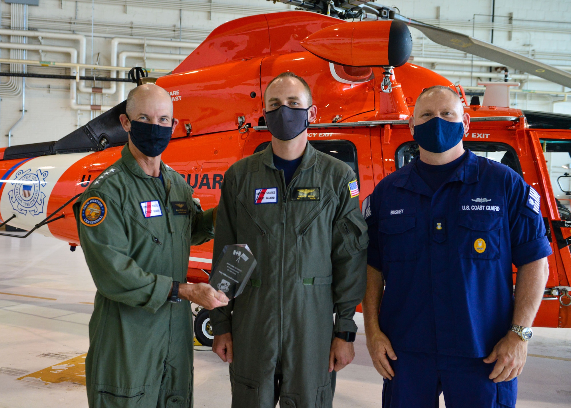 Adm. Charles Ray, the Vice Commandant of the Coast Guard and Deputy Master Chief Petty Officer of the Coast Guard Rob Bushey recognized Petty Officer 1st Class Andrew Anton, an avionics electrical technician as "Maintainer of the Year" for the Continental U.S. NORAD Region Aerospace Control Alert during a ceremony at the National Capital Region Air Defense Facility, Aug. 20, 2020.