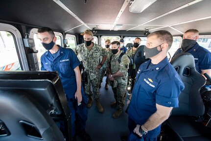 SILVERDALE, Wash. (Sept. 1, 2020) – Adm. Charles Richard, Commander, U.S. Strategic Command, meets with Maritime Force Protection Unit personnel and receives a demonstration on a remote operated small arms mount from Boatswain's Mate 3rd Class Kevin Ring, from Mashpee, Massachusetts, during a visit with strategic-deterrent units onboard Naval Base Kitsap-Bangor, Sept. 1. U.S. Strategic Command is a global warfighting combatant command whose mission is to deter strategic attack and employ forces, as directed, to guarantee the security of the U.S. and its allies. (U.S. Navy photo my Mass Communication Specialist 1st Class Andrea Perez/Released)