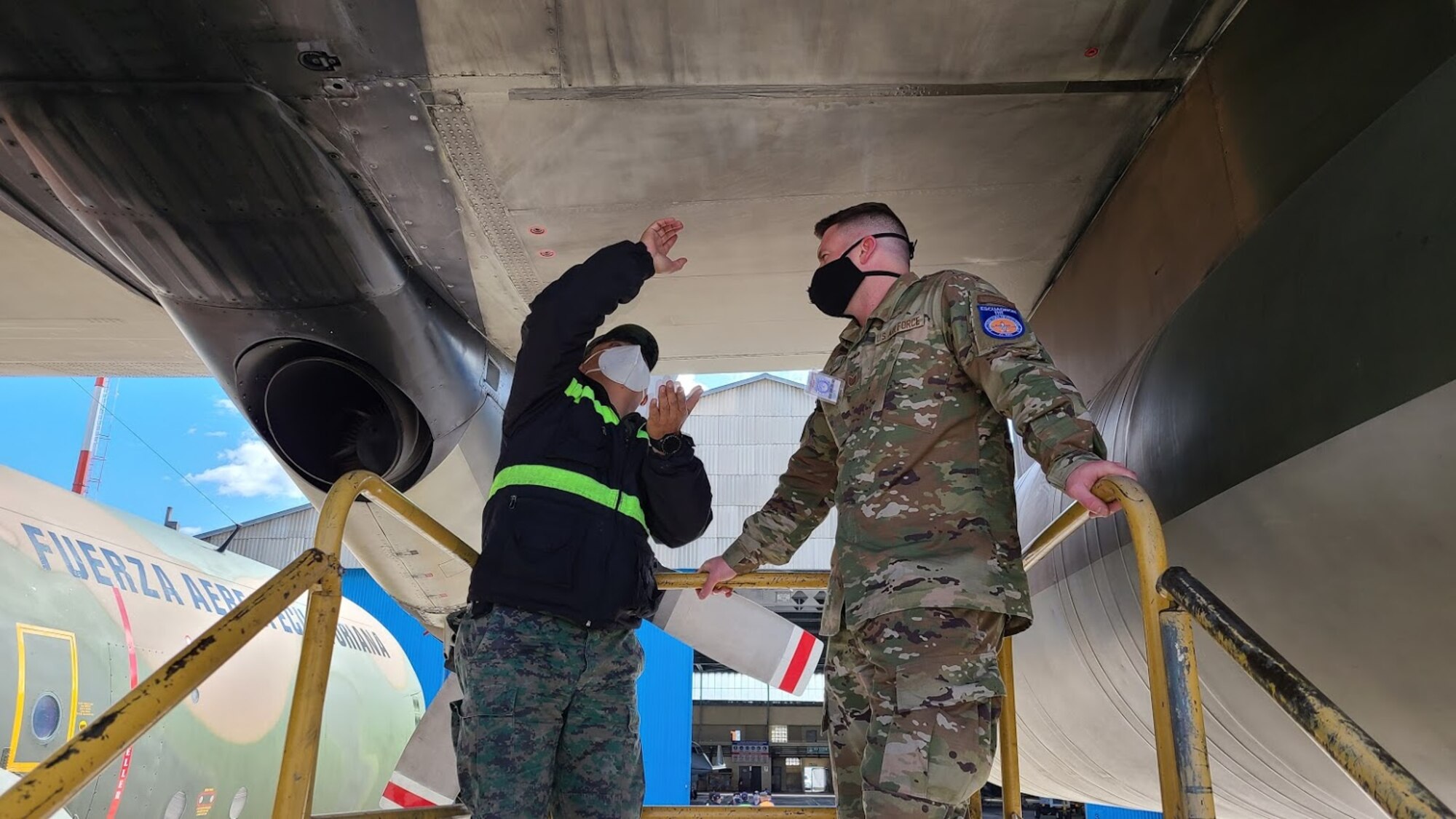 An Airman assigned to the 571st Mobility Support Advisory Squadron at Travis Air Force Base, California, instructs a member of the Ecuadorian Air Force on aircraft maintenance operations July 28, 2020 in Latacunga, Ecuador, as part of the Air Force Security Assistance and Training Squadron international partner training. Air Force international partner training has resumed under AFSAT after it was briefly halted in mid-March due to the COVID-19 pandemic. (U.S. Air Force courtesy photo)