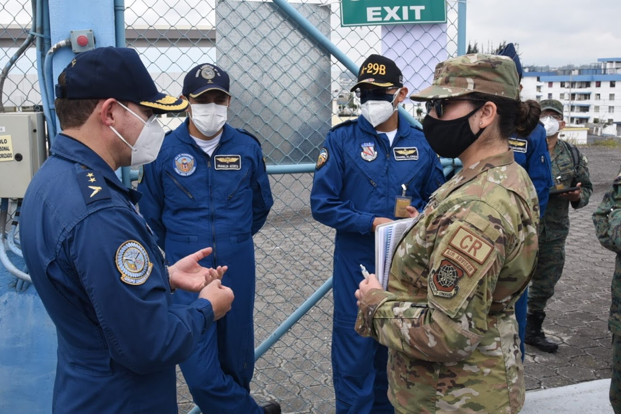 An Airman assigned to the 571st Mobility Support Advisory Squadron at Travis Air Force Base, California, discusses aircraft maintenance operations with a member of the Ecuadorian Air Force July 28, 2020 in Latacunga, Ecuador, as part of the Air Force Security Assistance and Training Squadron international partner training. Air Force international partner training has resumed under AFSAT after it was briefly halted in mid-March due to the COVID-19 pandemic. (U.S. Air Force courtesy photo)
