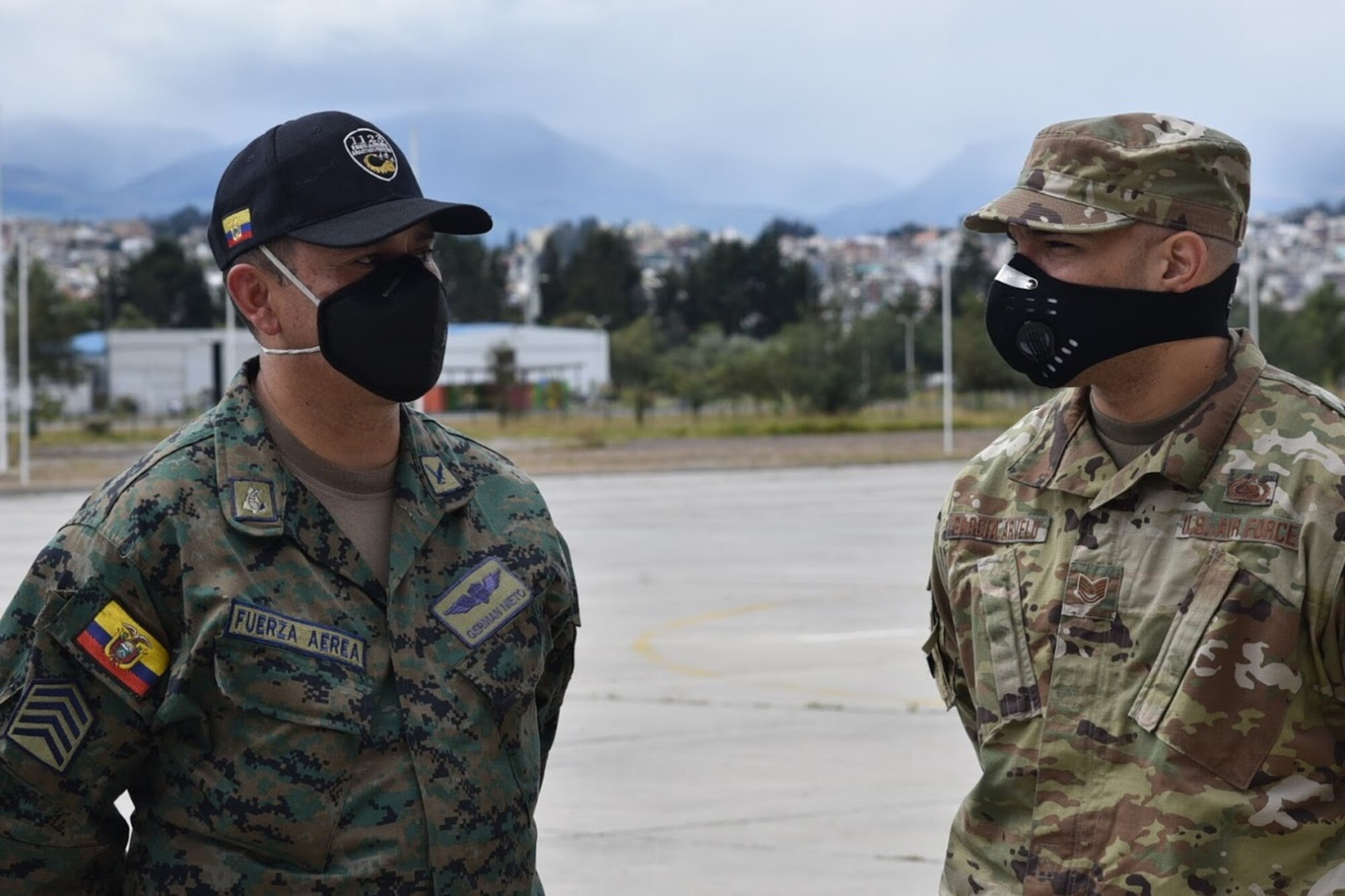 An Airman (right) assigned to the 571st Mobility Support Advisory Squadron at Travis Air Force Base, California, discusses aircraft maintenance operations with a member of the Ecuadorian Air Force July 28, 2020 in Latacunga, Ecuador, as part of the Air Force Security Assistance and Training Squadron international partner training. Air Force international partner training has resumed under AFSAT after it was briefly halted in mid-March due to the COVID-19 pandemic. (U.S. Air Force courtesy photo)