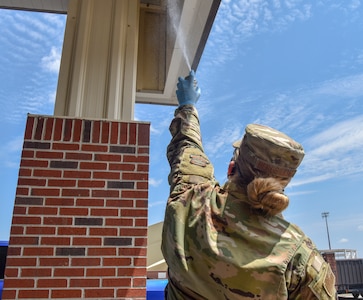 Senior Airman Jasmine Bergsieker, a pest management journeyman assigned to the 628th Civil Engineer Squadron, uses wasp freeze to eliminate wasp nests at Joint Base Charleston, S.C., Aug. 11, 2020. The pest management mission is to eliminate any type of pests to help keep the mission going and maintain readiness.