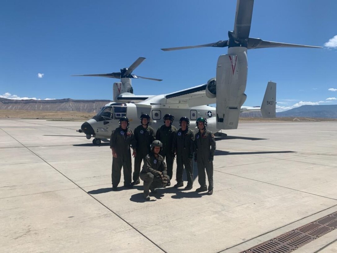 Defense Contract Management Agency personnel from DCMA Bell and DCMA Boeing stand in front of the first Navy CMV-22