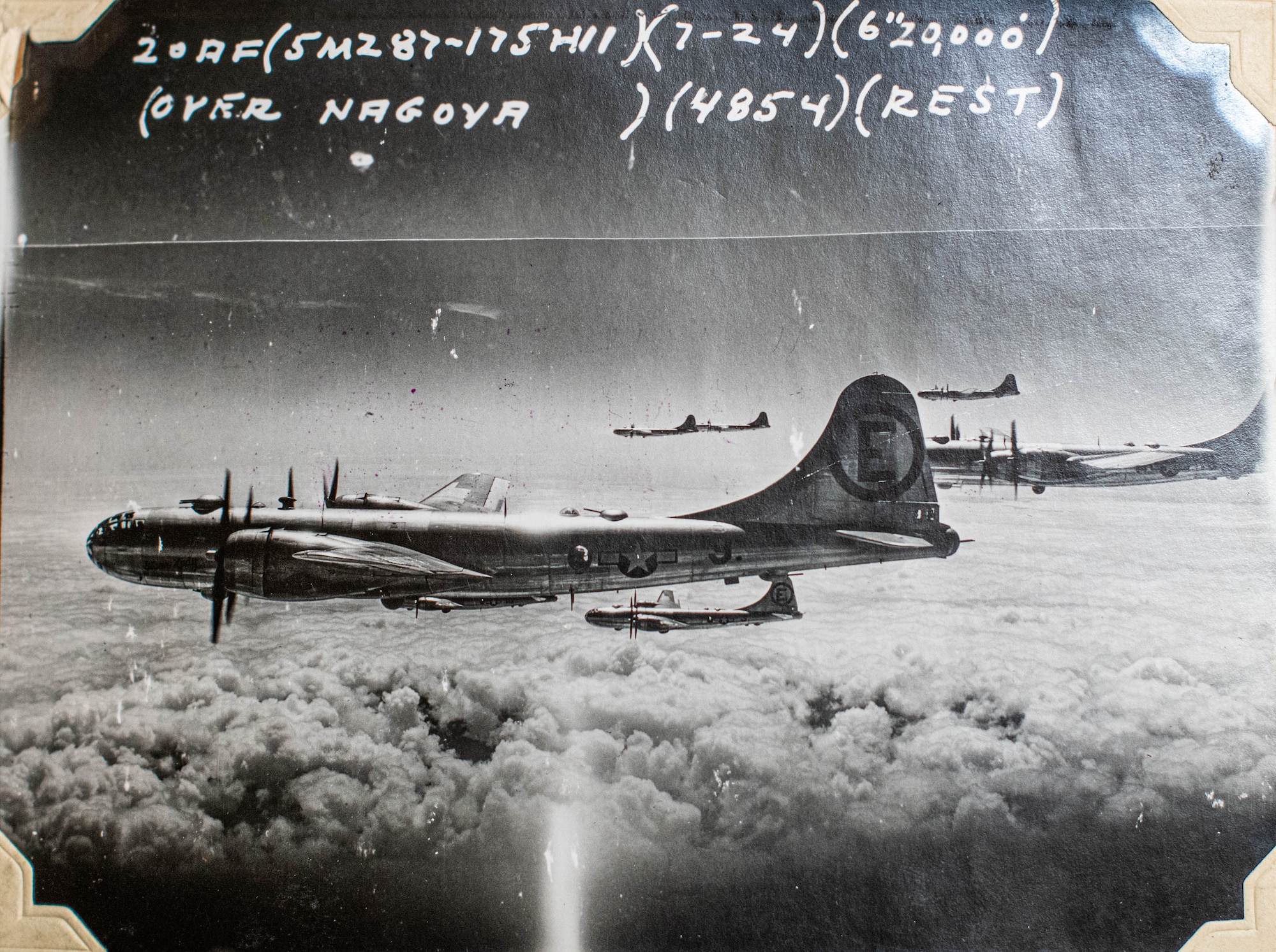 Several B-29 Superfortresses fly over Nagoya, Japan, during World War II.