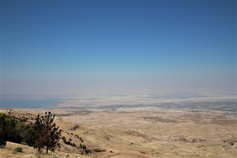 A view of the Jordan Valley from Mount Nebo. The Dead Sea is visible to the left, and the city of Jericho in the distance. With COVID-19 safety measures in place, the Area Support Group-Jordan Unit Ministry Team has provided Spiritual Resiliency Trips for service members stationed in Jordan. The U.S. military is in Jordan to partner with the Jordan Armed Forces to meet common security objectives in the region.