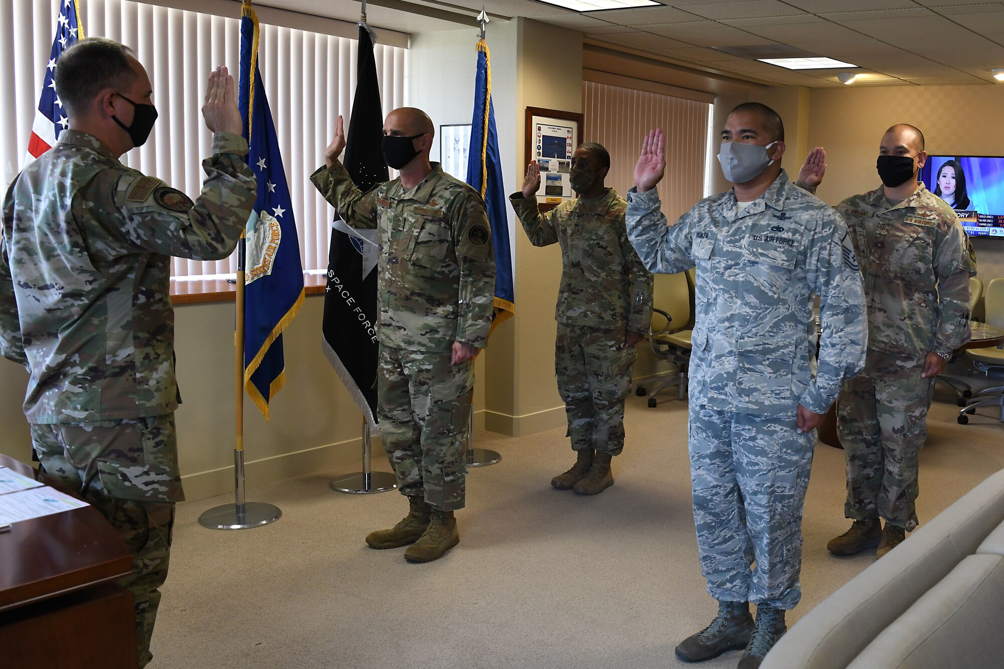 Maj. Gen. John E. Shaw, U.S. Space Force’s Space Operations Command commander, gives the enlisted oath to four enlisted members assigned to Vandenberg Air Force Base into the United States Space Force, Sept. 1, 2020, at Vandenberg AFB, Calif.