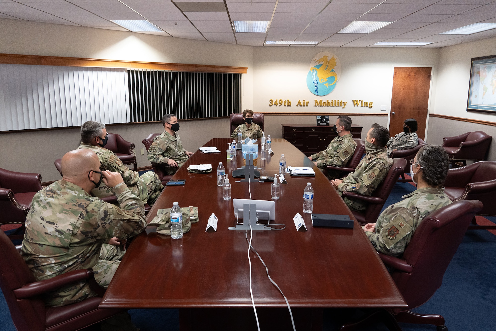 U.S. Air Force Gen. Jacqueline D. Van Ovost, Air Mobility Command commander, and AMC command chief, Chief Master Sgt. Brian P. Kruzelnick, receive a mission briefing at 349th Air Mobility Wing Headquarters, Travis Air Force Base, Calif., Sept. 1, 2020.