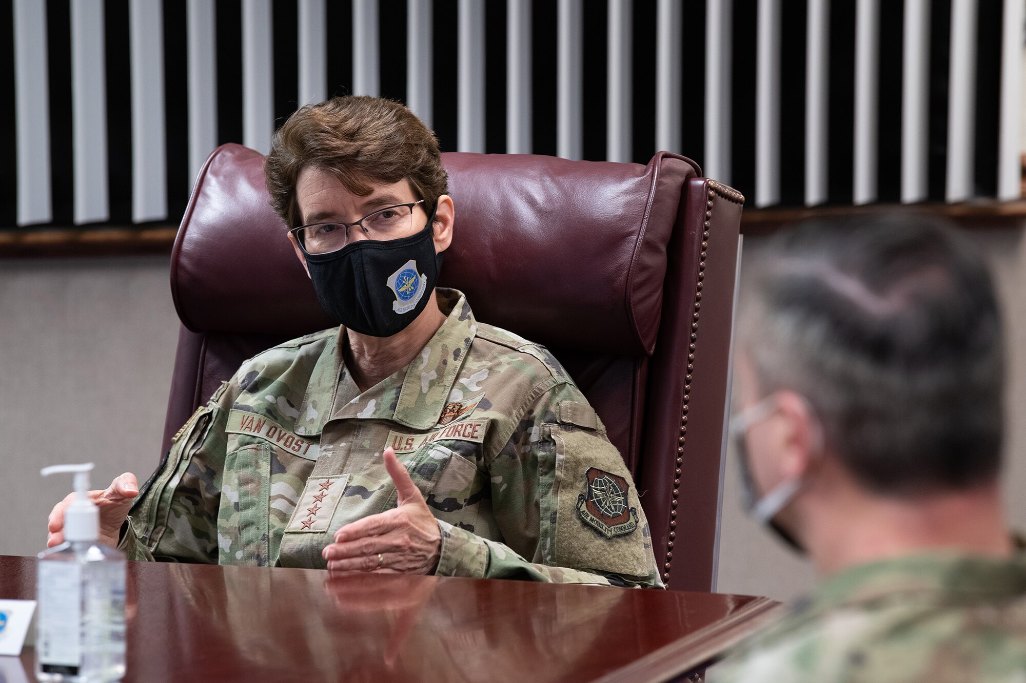 U.S. Air Force Gen. Jacqueline D. Van Ovost, Air Mobility Command commander, speaks with Col. Lee Merkle, 349th Air Mobility Wing commander, during a mission briefing at 349th Air Mobility Wing Headquarters, Travis Air Force Base, California, Sept. 1, 2020.