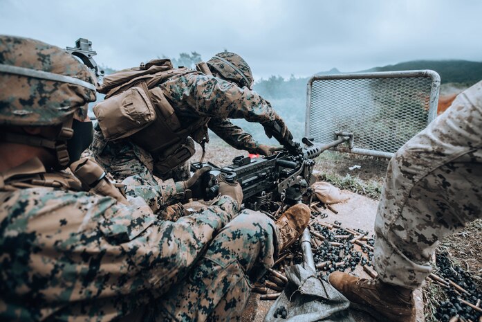 U.S. Marines fire an M2 .50 caliber machine gun on Camp Hansen, Okinawa, Japan, Aug. 26.