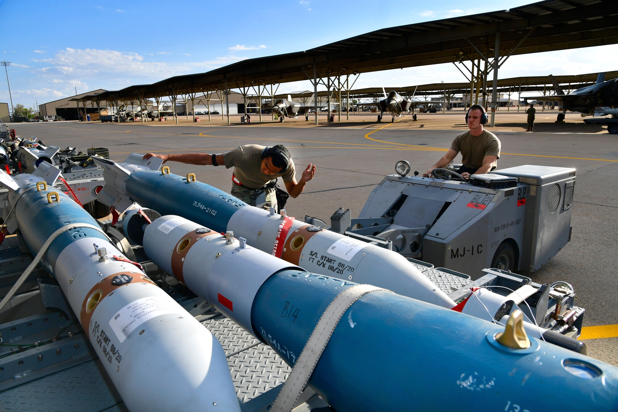 a photo of a weapons load crew