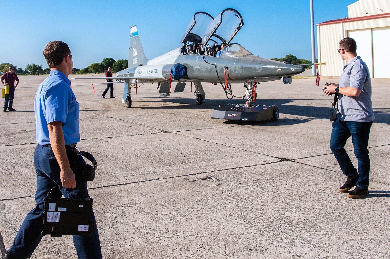 Members from the 12th Maintenance Group conduct a towing stress test on a T-38 aircraft August 27, 2020 at Joint Base San Antonio-Randolph. The remotely controlled aircraft towing system will reduce manpower requirements, allow close quarter towing and quicker aircraft stowing ahead of inclement weather.