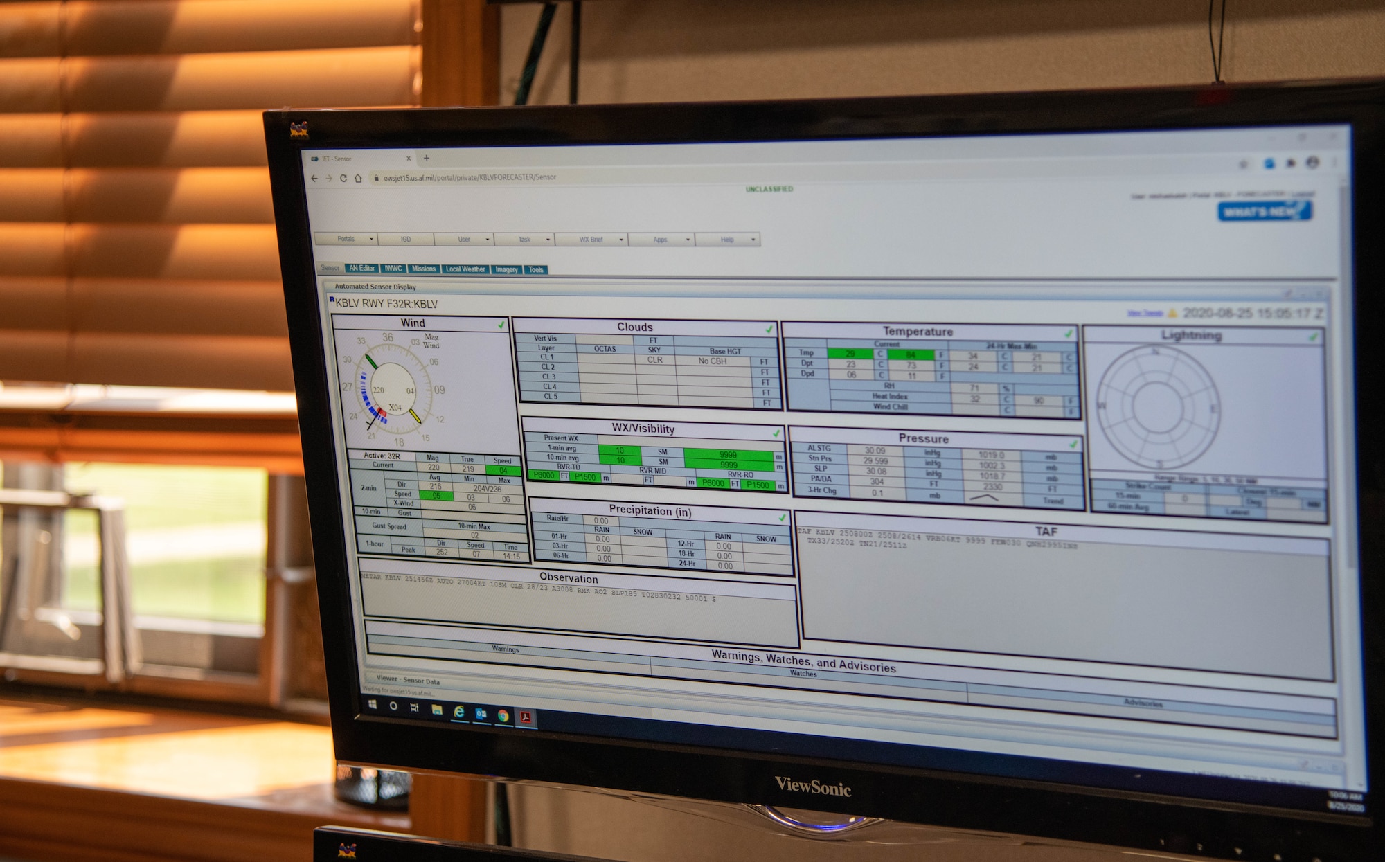 Detail photograph of weather data on a screen.