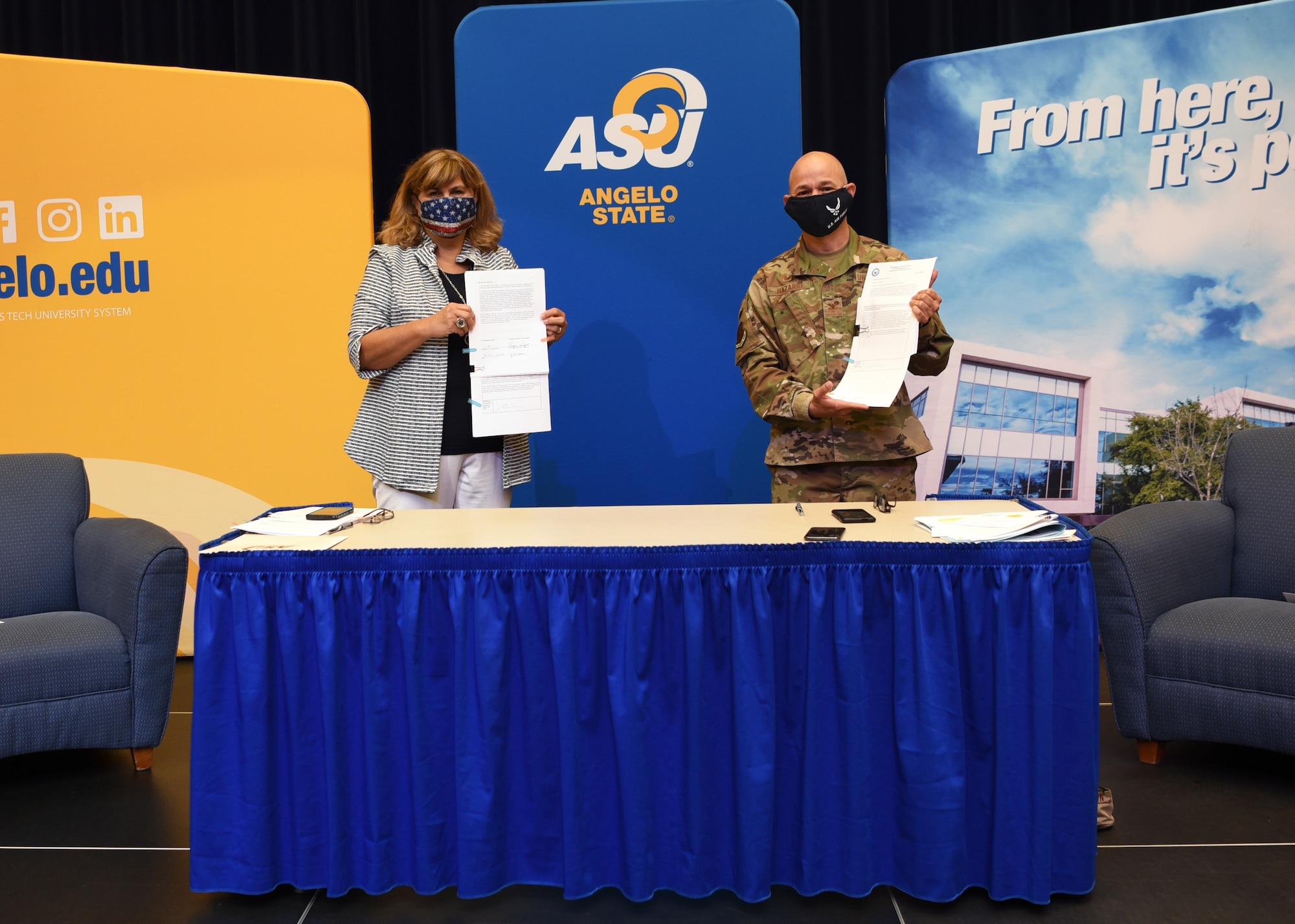 Angelo State University Interim President, Angie Wright and U.S. Air Force Col. Andres Nazario, 17th Training Wing commander, each display a signed intergovernmental support agreement, for teaching and educating the next generation of civilian and military leaders, at ASU’s Houston Harte University Center in San Angelo, Texas, Aug. 21, 2020. The agreement between ASU, the city of San Angelo, and Goodfellow was the first of its kind for Goodfellow, partially the Air Force, and together they will blaze a trail for the Department of Defense. (U.S. Air Force photo by Senior Airman Abbey Rieves)