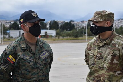 An Airman (right) assigned to the 571st Mobility Support Advisory Squadron at Travis Air Force Base, California, discusses aircraft maintenance operations with a member of the Ecuadorian Air Force July 28, 2020 in Latacunga, Ecuador, as part of the Air Force Security Assistance and Training Squadron international partner training. Air Force international partner training has resumed under AFSAT after it was briefly halted in mid-March due to the COVID-19 pandemic. (U.S. Air Force courtesy photo)