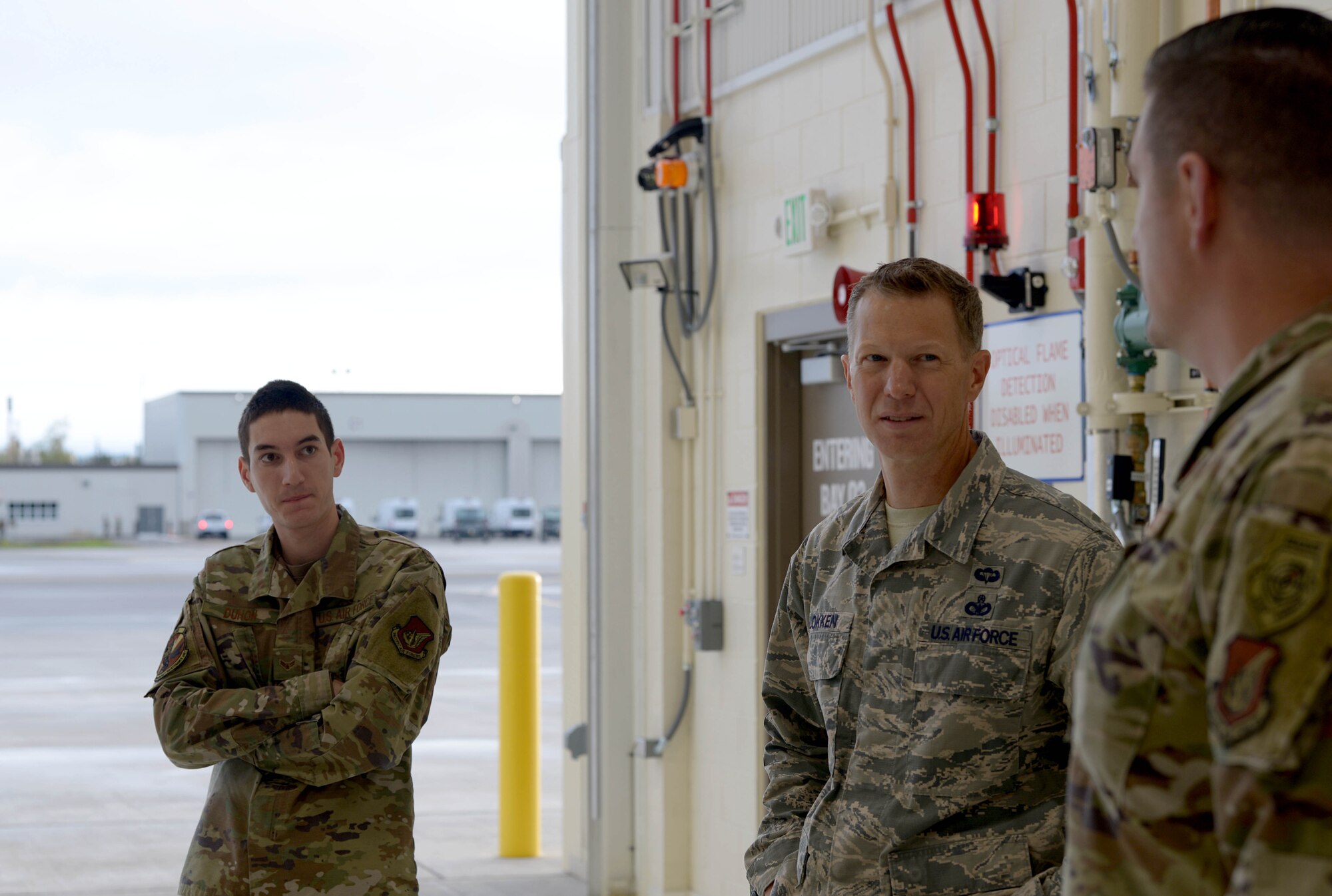 U.S. Air Force Chief Master Sgt. John Lokken, the 354th Fighter Wing (FW) command chief, talks with Chief Master Sgt. Robert Soto, the 354th Aircraft Maintenance Squadron (AMXS) superintendent, and Airman 1st Class Devin Duhon, 354th AMXS F-35A Lightning II crew chief, on Eielson Air Force Base, Alaska, Aug. 28, 2020.