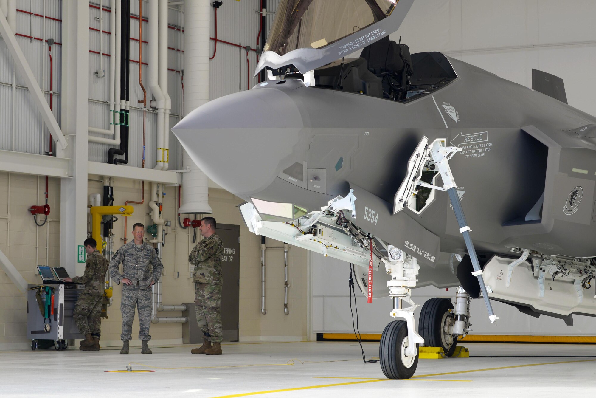 U.S. Air Force Chief Master Sgt. John Lokken, the 354th Fighter Wing command chief, talks with Chief Master Sgt. Robert Soto, the 354th Aircraft Maintenance Squadron (AMXS) superintendent, on Eielson Air Force Base, Alaska, Aug. 28, 2020.