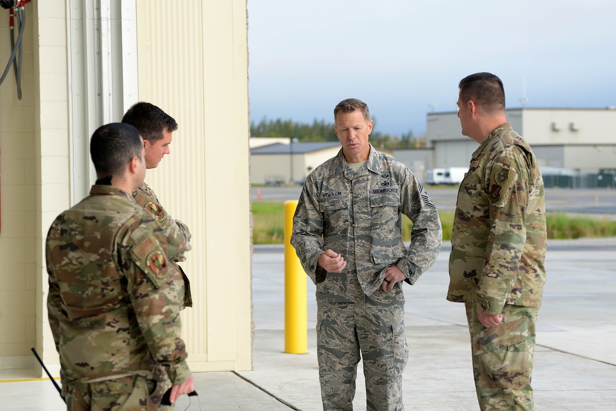 U.S. Air Force Chief Master Sgt. John Lokken, the 354th Fighter Wing command chief, talks with aircraft maintainers on Eielson Air Force Base, Alaska, Aug. 28, 2020.