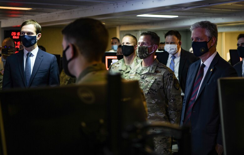 Robert O’Brien (from right), National Security Advisor, Brig. Gen. Larry Broadwell, 380th Air Expeditionary Wing commander, and Jared Kushner,  Senior Advisor to the President of the United States, get briefed on mission capabilities at the 727th Expeditionary Air Control Squadron, September 1, 2020, at Al Dhafra Air Base, United Arab Emirates.