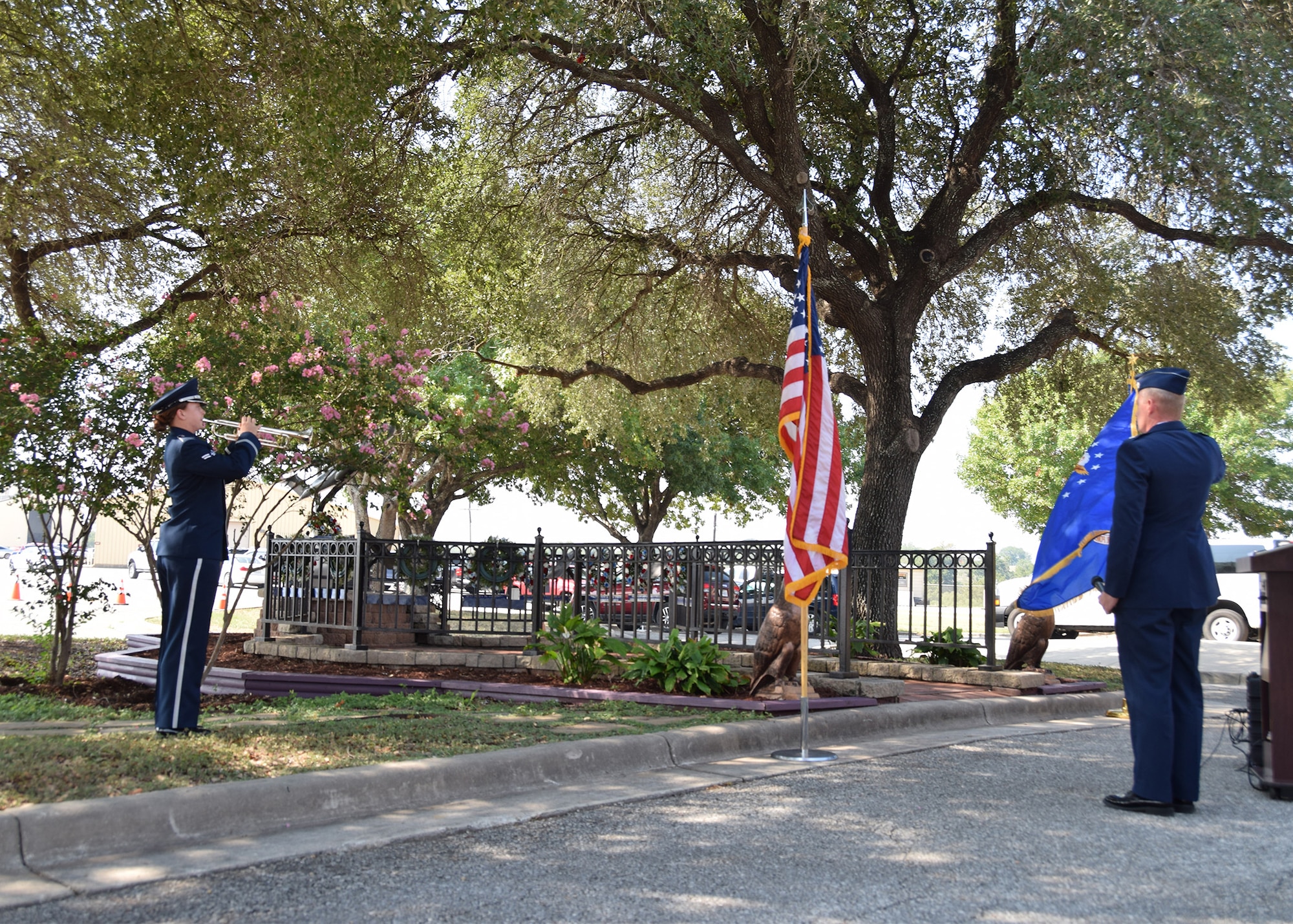 Airman 1st Class Clare W. Hogan, Band of the West, plays Taps at a remembrance and wreath laying ceremony for the fallen Airmen from mission BRAVO-12 Aug. 28, 2020 at Joint Base San Antonio-Lackland, Texas.