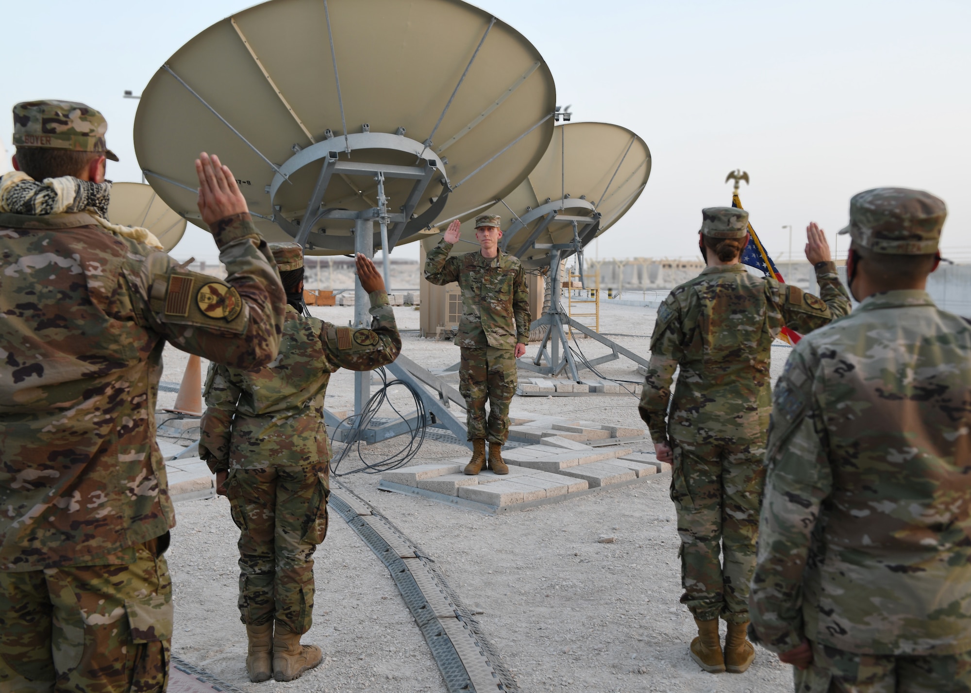 Col. Todd Benson, the U.S. Air Forces Central Command director of space forces, leads Airmen through their enlistment ceremony as they became members of the Space Force at Al Udeid Air Base, Qatar, on Sept. 1, 2020. The Space Force is the United States' newest service in more than 70 years. (U.S. Air Force photo by Staff Sgt. Kayla White)