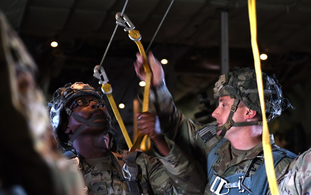 U.S. Army Soldiers assigned to the 173rd Airborne Brigade performpreform a safety check prior to reaching the drop zone at the Vaziani Training Area, Georgia, Sept. 1, 2020.