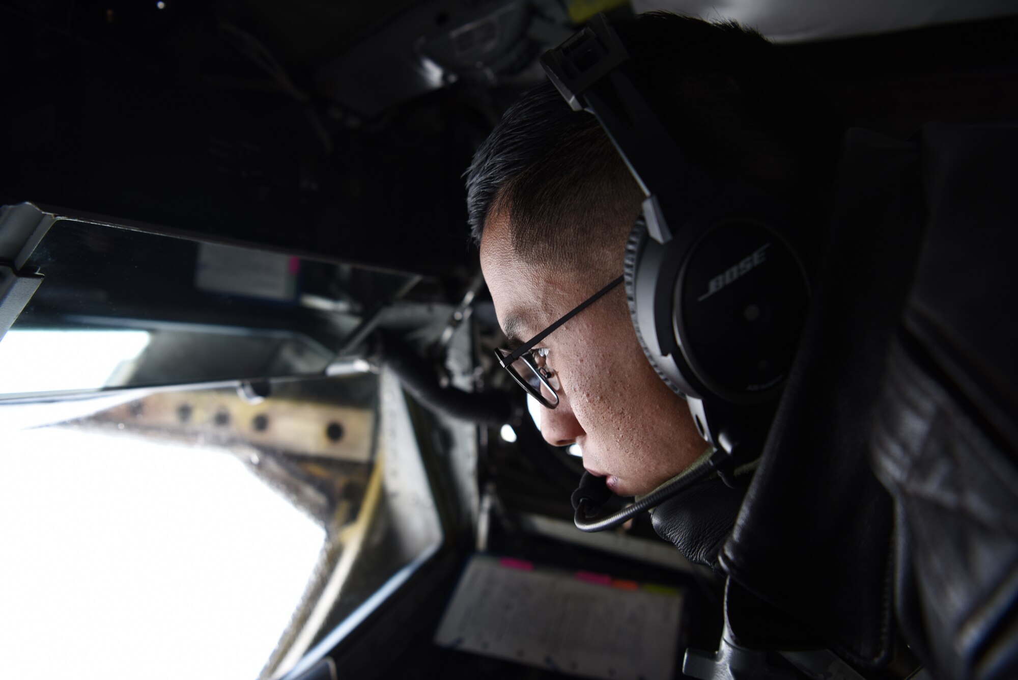 Airman 1st Class Jose Retana, 351st Air Refueling Squadron boom operator, prepares to lower the boom on a KC-135 Stratotanker during a Bomber Task Force mission over the waters of Norway, on Sept. 2, 2020.