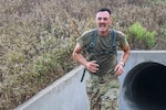 Sgt. 1st Class Christopher Wittig, Kansas Army National Guard, runs after tunneling through a wet culvert, Aug. 30, 2020, at the Greenlief Training Site, near Hastings, Nebraska, during the inaugural All Guard Endurance Team time trials.