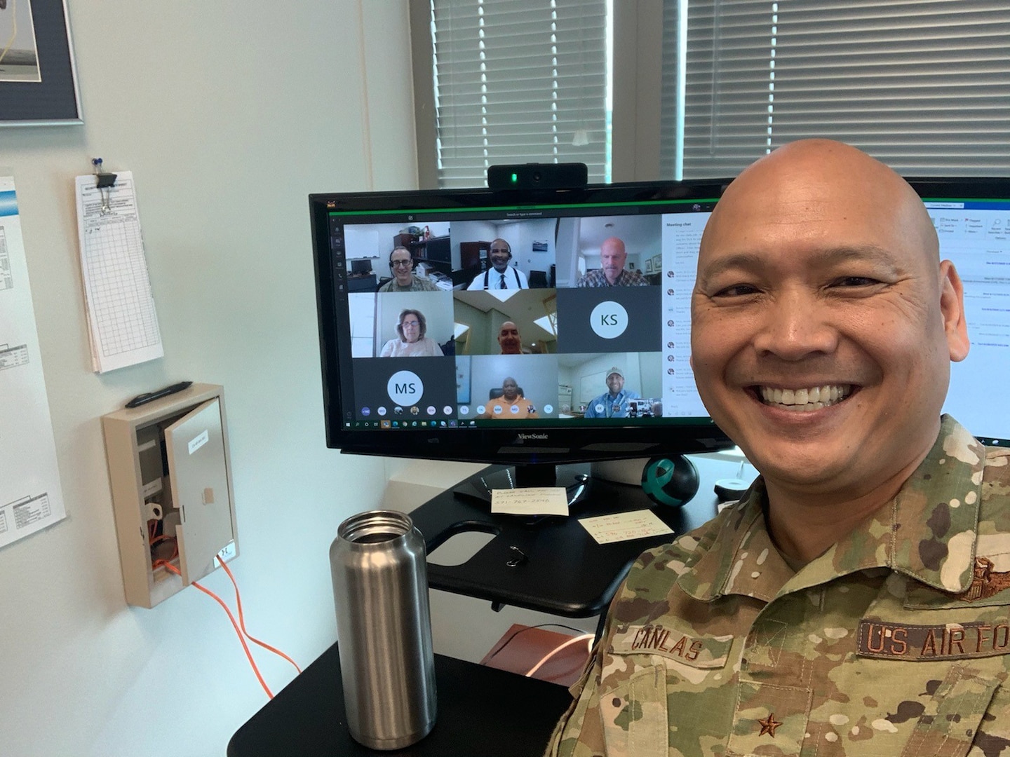 Air Force general officer takes selfie with computer screen