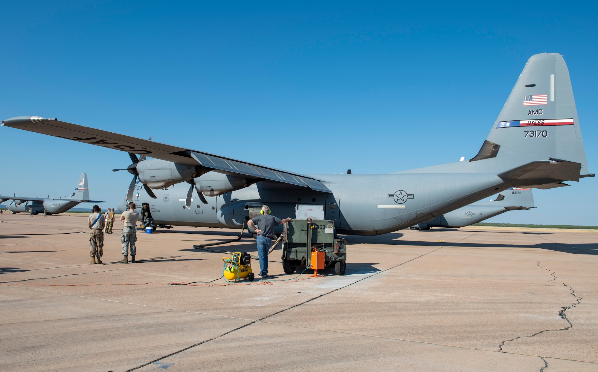 Airmen assigned to the 317th Airlift Wing and research scientists assigned to the 711th Human Performance Wing at Wright-Patterson Air Force Base, Ohio, stand outside of a C-130J Super Hercules at Dyess AFB, Texas, Aug. 26, 2020.