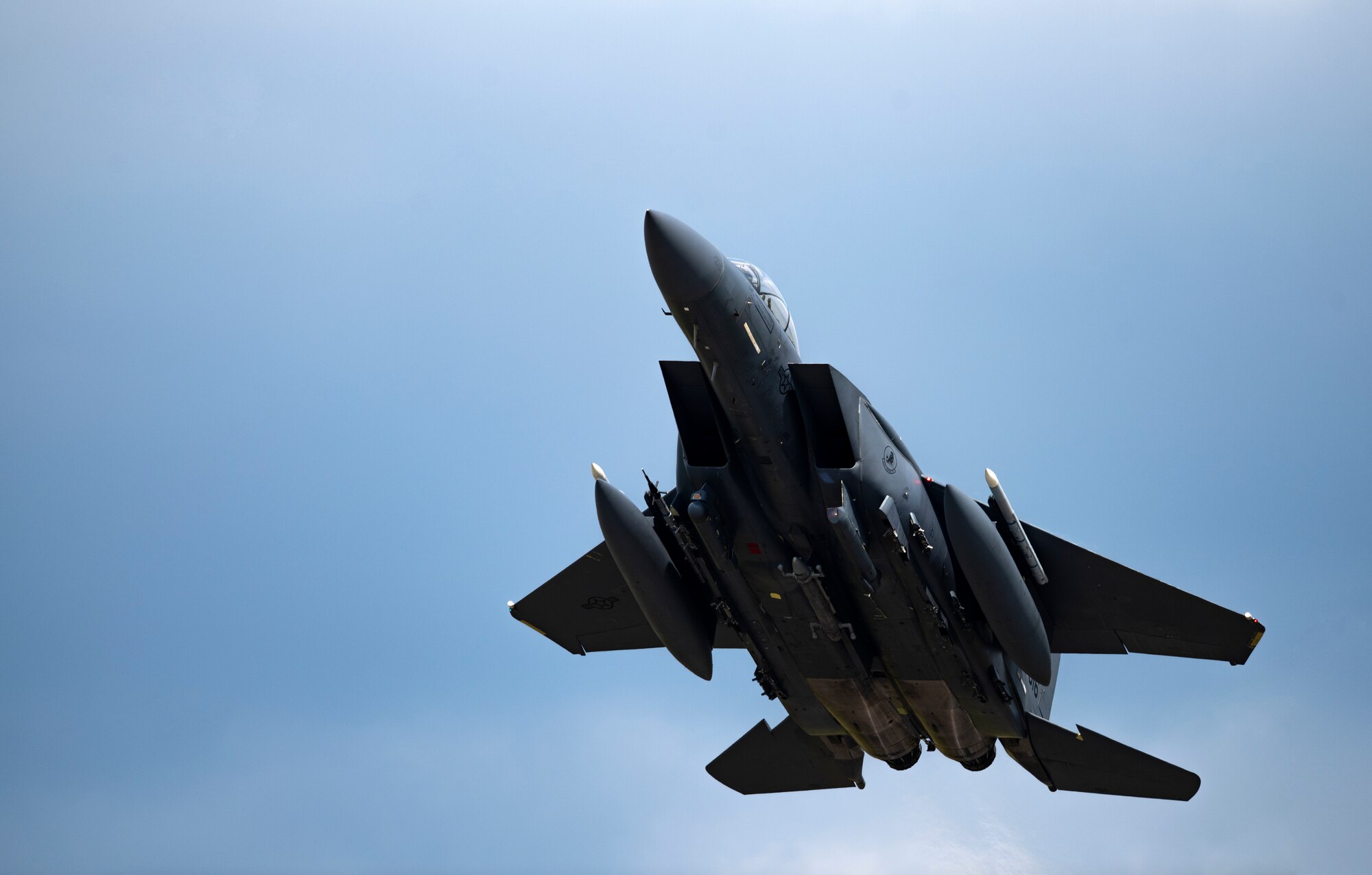 A U.S. Air Force F-15E Strike Eagle, assigned to the 492nd  Fighter Squadron, flies overhead at Royal Air Force Lakenheath, England, Sept. 1, 2020. The 48th Fighter Wing conducts routine training in order to maintain combat readiness and safeguard U.S. national interests and the collective defense of allies and partners. (U.S. Air Force photo by Airman 1st Class Jessi Monte)