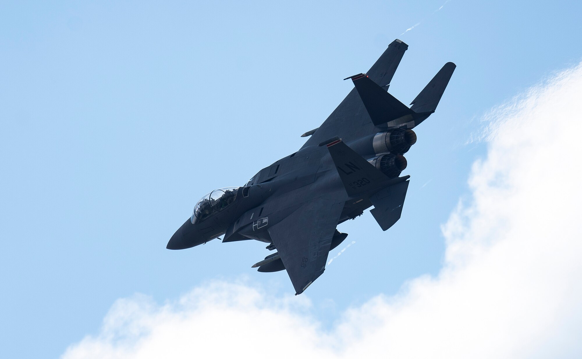 A U.S. Air Force F-15E Strike Eagle, assigned to the 494th  Fighter Squadron, flies overhead at Royal Air Force Lakenheath, England, Sept. 1, 2020. The 48th Fighter Wing conducts routine training in order to maintain combat readiness and safeguard U.S. national interests and the collective defense of allies and partners. (U.S. Air Force photo by Airman 1st Class Jessi Monte)